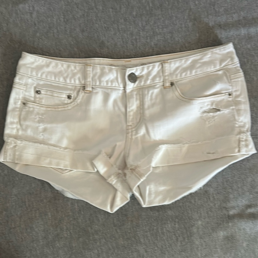 White size 10 American Eagle midi distressed shorts.